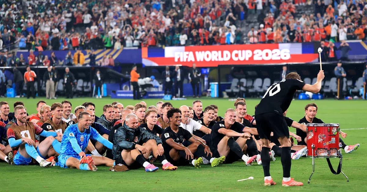 Football team celebrating with drums after match