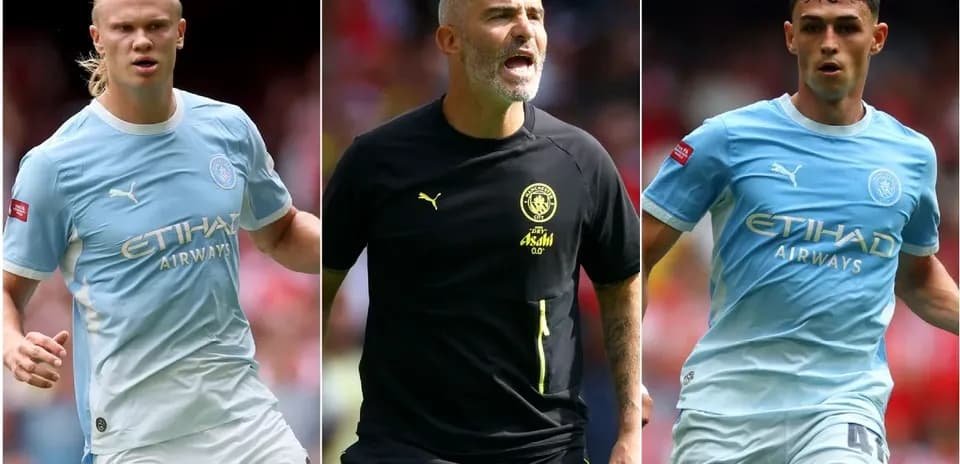Manchester City players and coach during match action