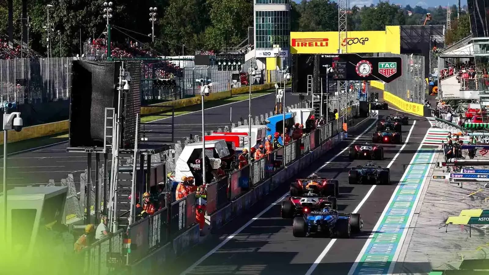 Formula 1 cars in pit lane during race Formula 1 cars in pit lane during race