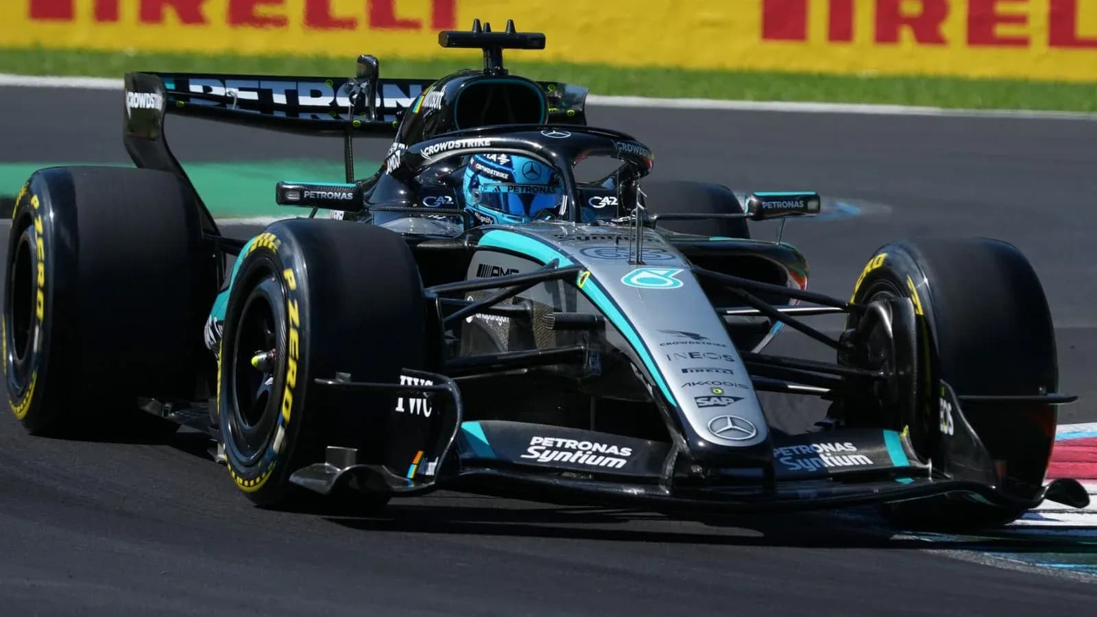 Formula 1 car racing on track during competition Formula 1 car racing on track during competition