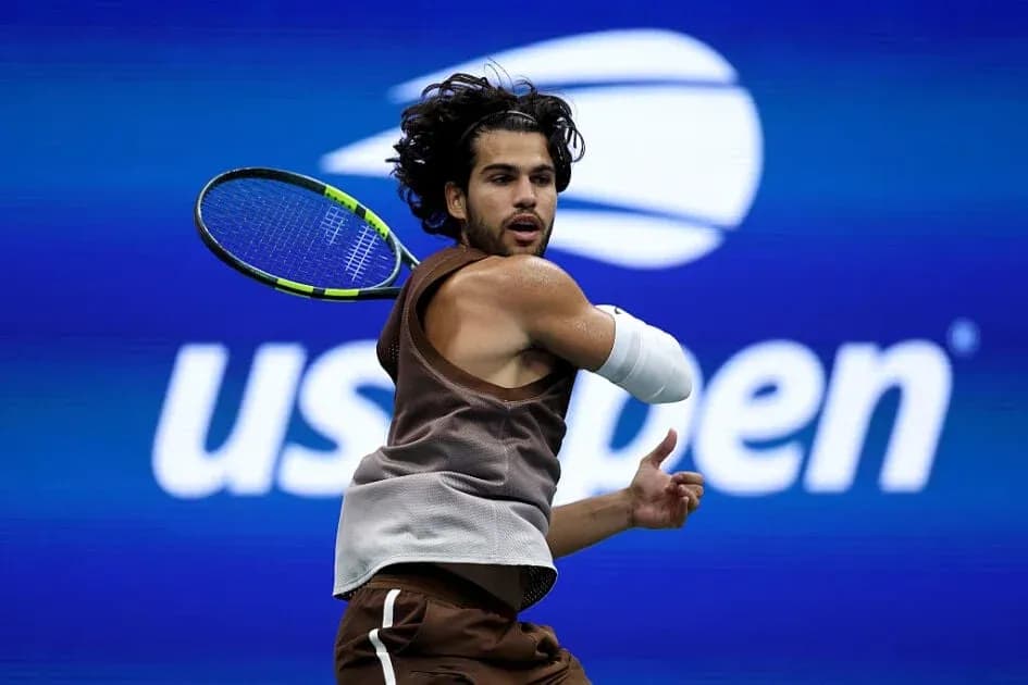 Tennis player hitting backhand at US Open Tennis player hitting backhand at US Open