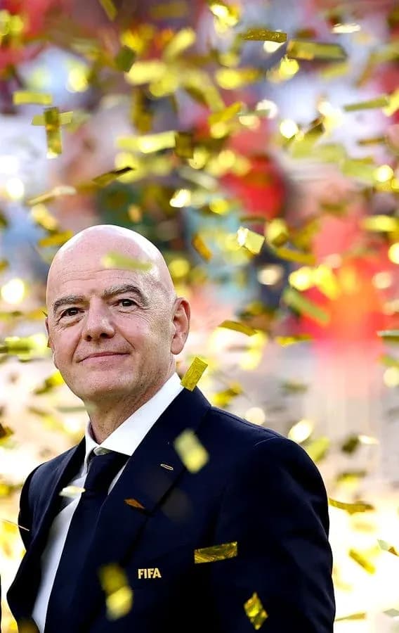 FIFA official standing amidst confetti celebration FIFA official standing amidst confetti celebration