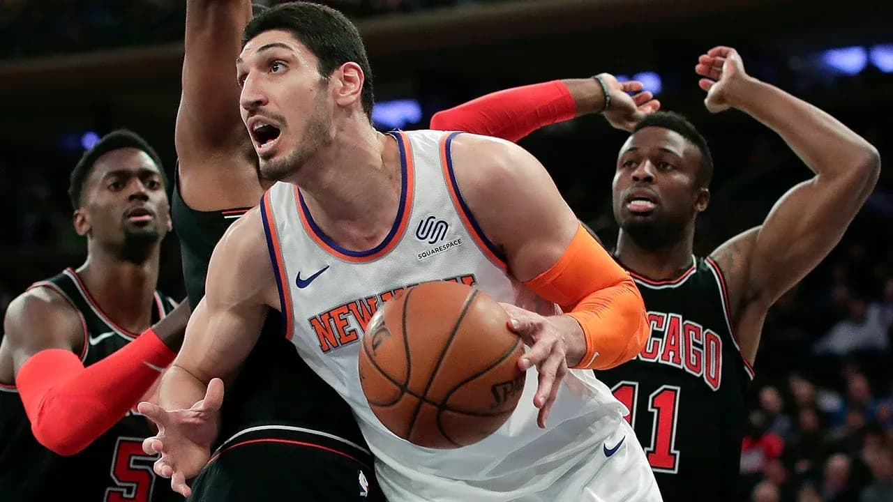New York Knicks player battling for the ball New York Knicks player battling for the ball
