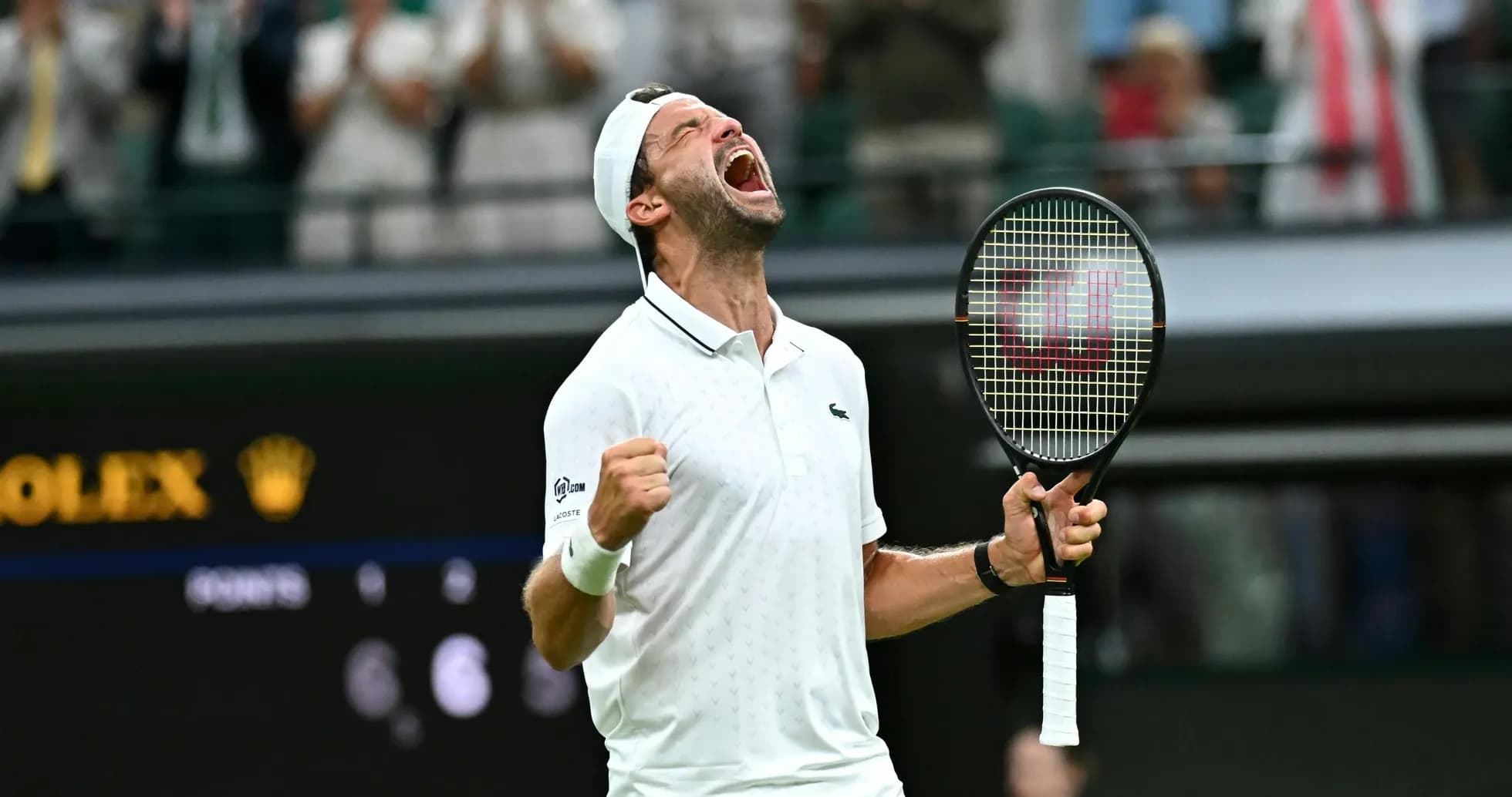 Tennis player celebrating victory at Wimbledon match Tennis player celebrating victory at Wimbledon match