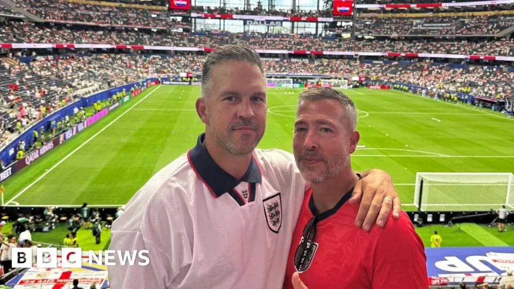Two fans posing in stadium before match Two fans posing in stadium before match