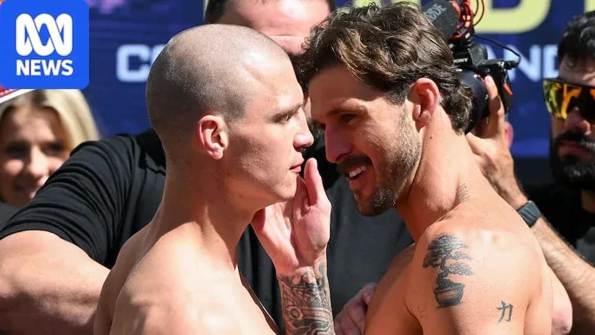 Two fighters facing off during weigh-in event Two fighters facing off during weigh-in event