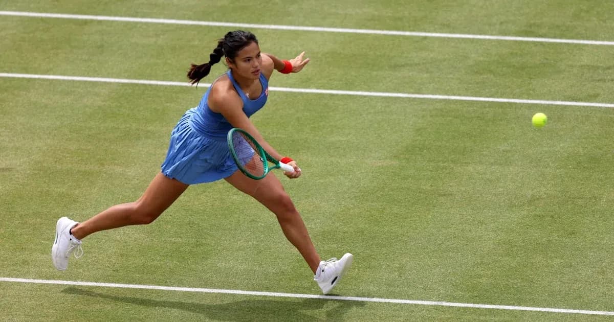 Tennis player reaching for a ball on court Tennis player reaching for a ball on court