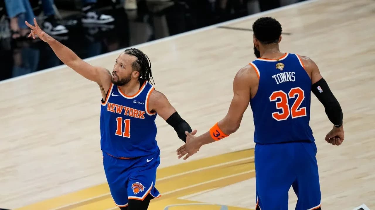 New York Knicks players celebrating on the court New York Knicks players celebrating on the court