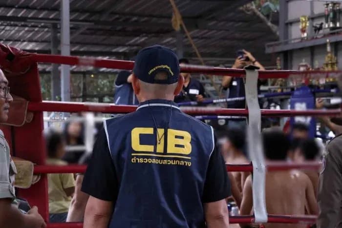 CIB officer observing boxing match in gym CIB officer observing boxing match in gym