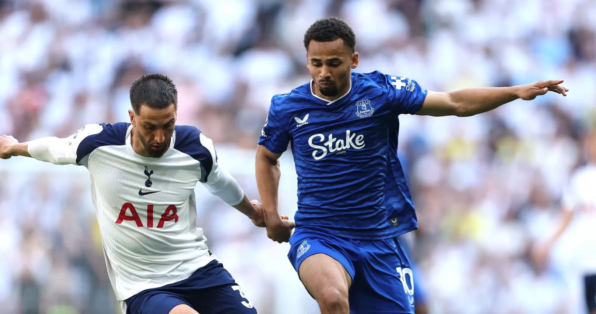 Tottenham and Everton players contesting the ball Tottenham and Everton players contesting the ball