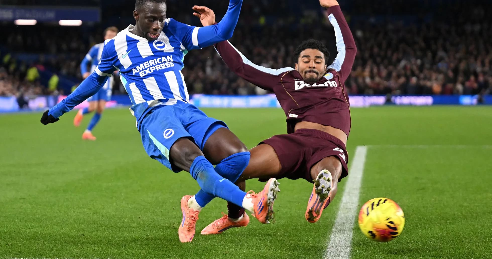Two players colliding during a football match Two players colliding during a football match