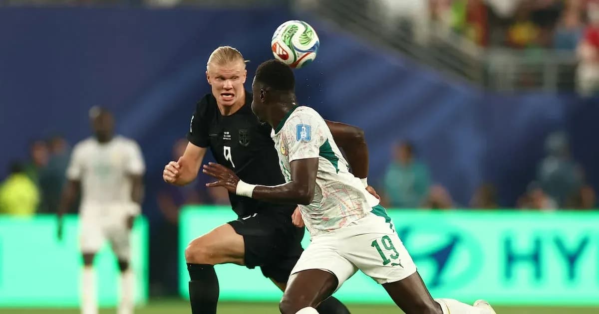 Two players competing for the ball during match Two players competing for the ball during match