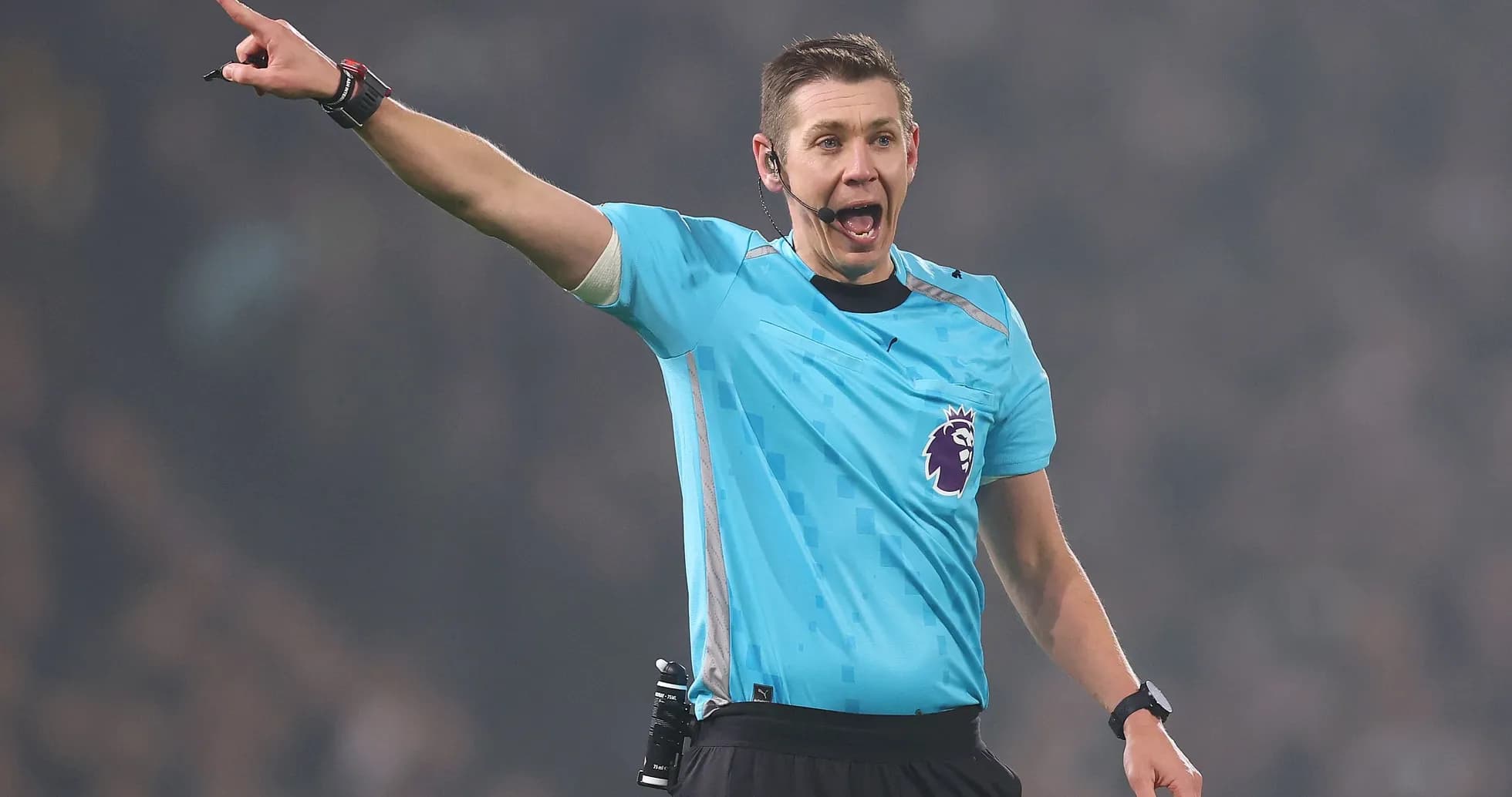 Referee signaling during a Premier League match Referee signaling during a Premier League match