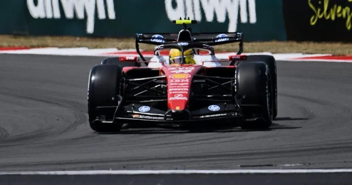 Formula 1 car navigating a sharp turn on track Formula 1 car navigating a sharp turn on track