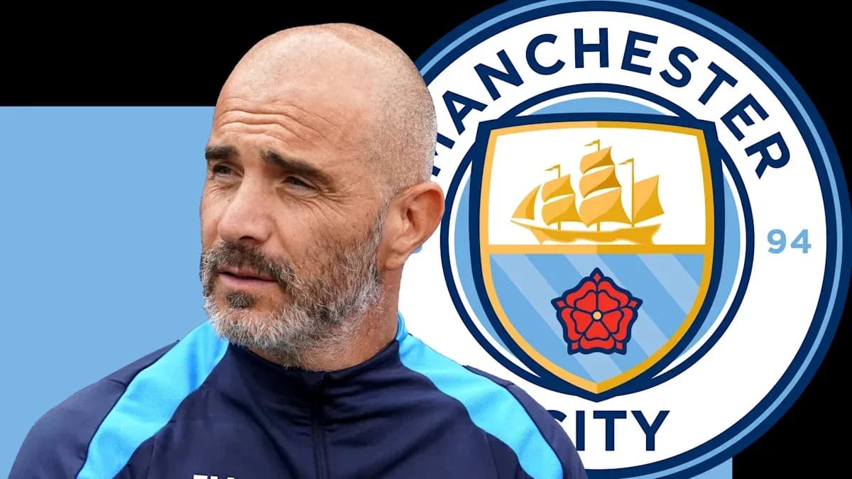 Coach near Manchester City logo during press event Coach near Manchester City logo during press event