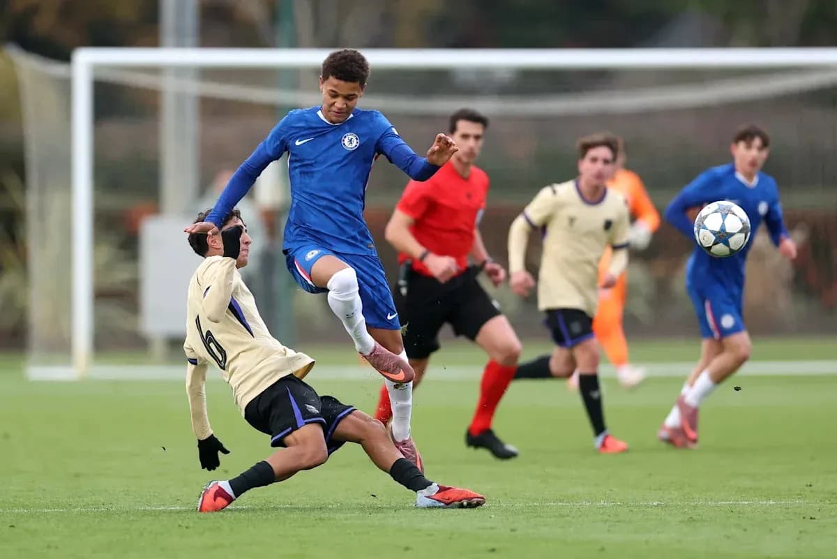 Player tackling opponent during youth football match Player tackling opponent during youth football match