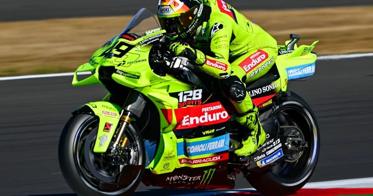 Motocyclist racing on green bike during competition Motocyclist racing on green bike during competition