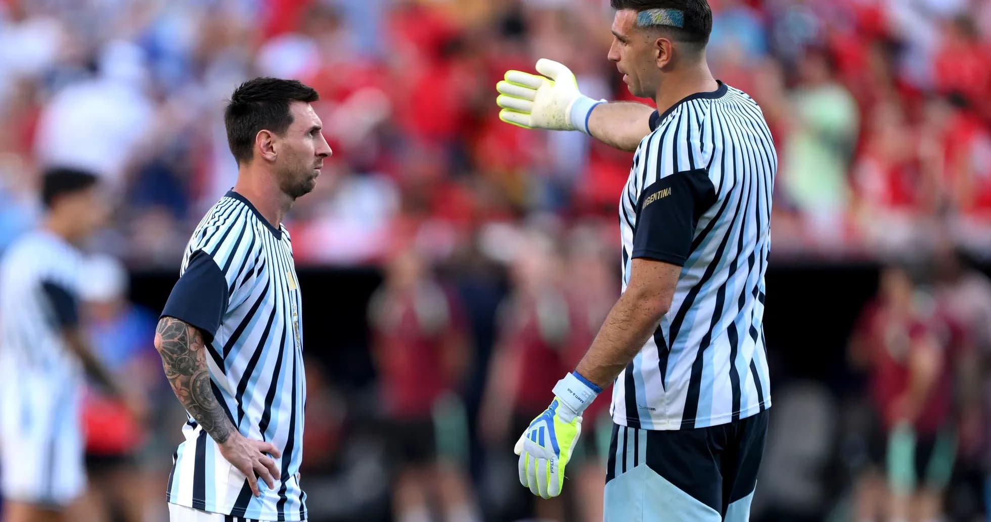 Messi and goalkeeper discussing on the field Messi and goalkeeper discussing on the field