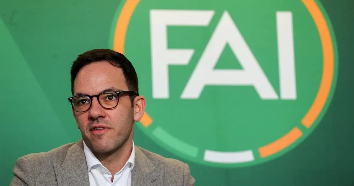 Man speaking at FAI press conference backdrop Man speaking at FAI press conference backdrop