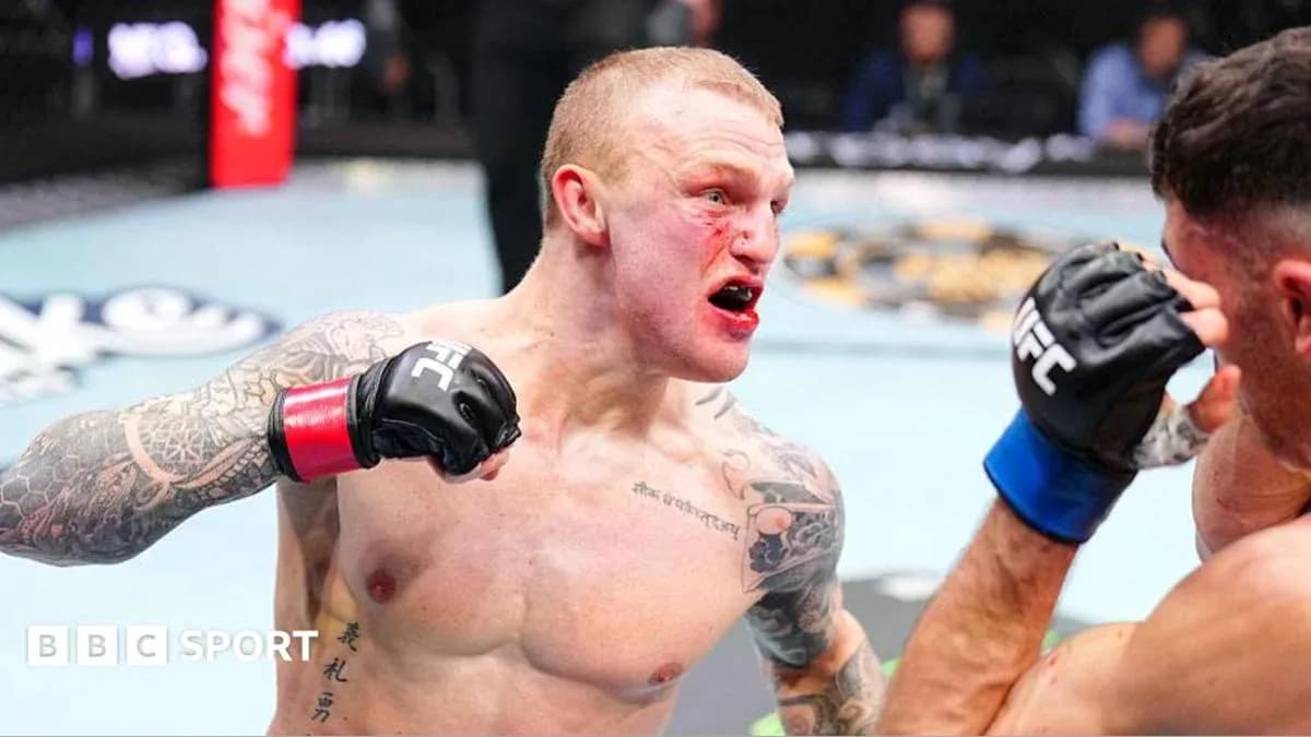 Fighter delivering a punch during UFC match Fighter delivering a punch during UFC match