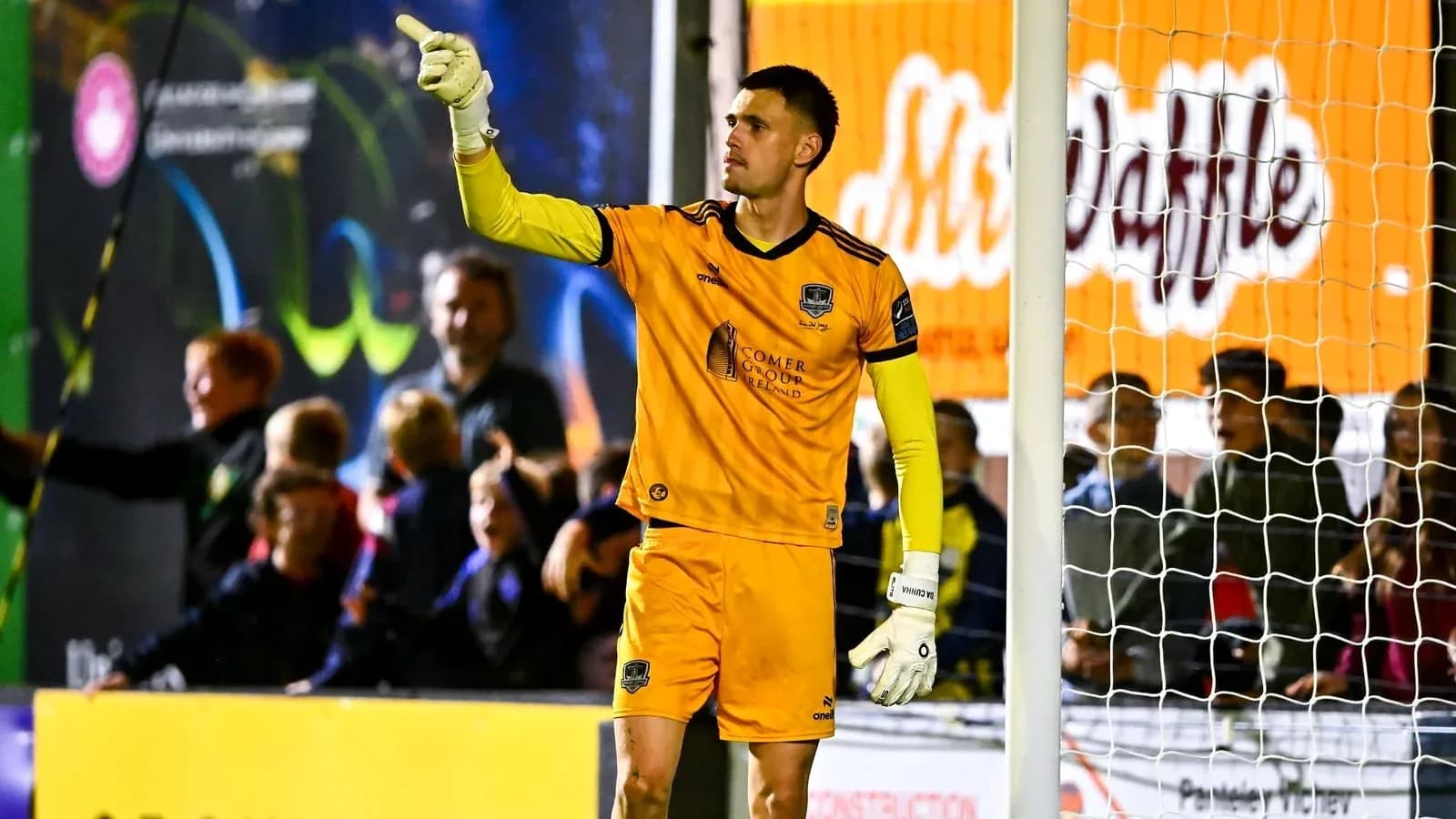 Goalkeeper signaling during a match at stadium Goalkeeper signaling during a match at stadium
