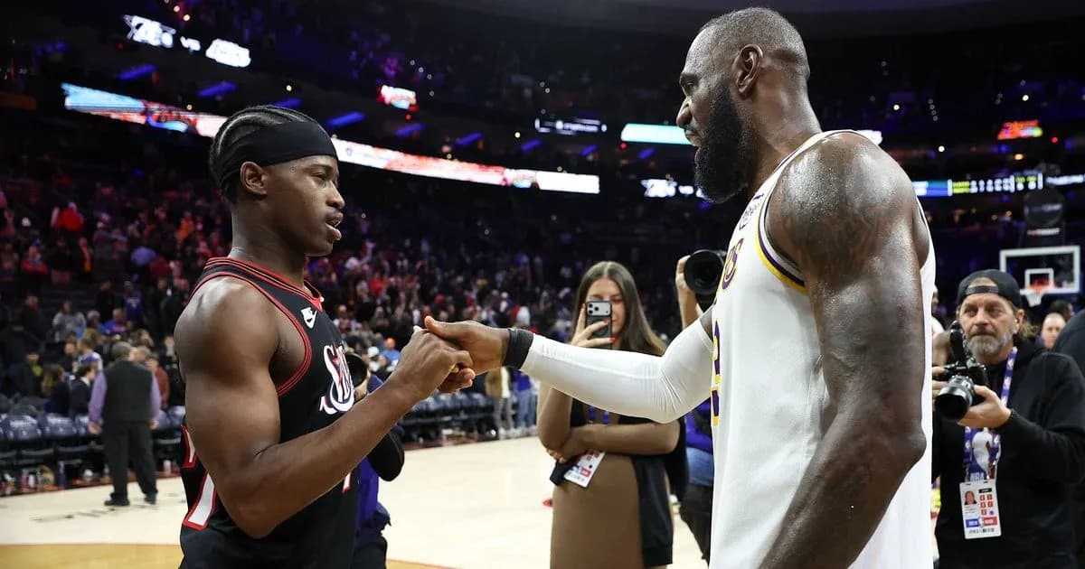 Two basketball players shaking hands after the game Two basketball players shaking hands after the game