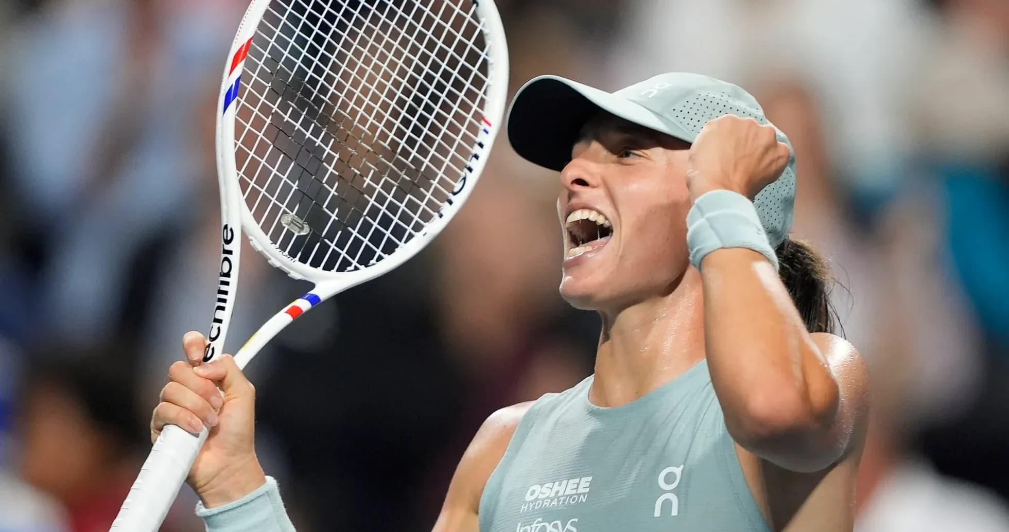 Tennis player celebrating with racket in hand Tennis player celebrating with racket in hand