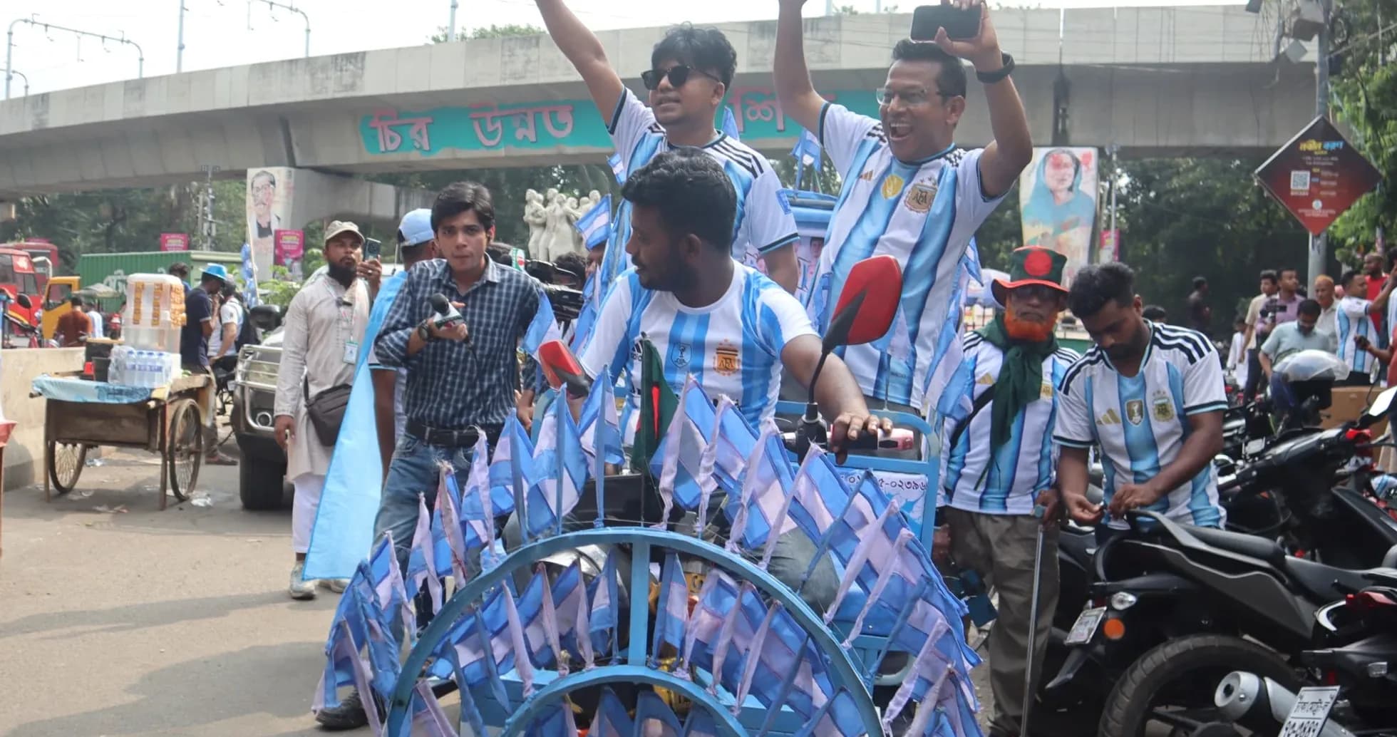 Fans celebrating with flags before a match Fans celebrating with flags before a match