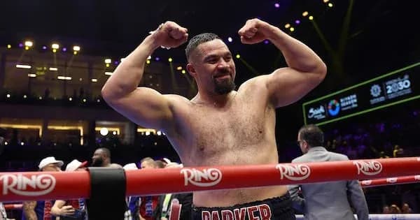 Boxer celebrating victory in the ring Boxer celebrating victory in the ring