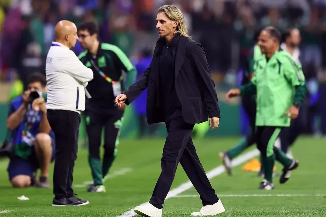 Coach walking on the field during match Coach walking on the field during match