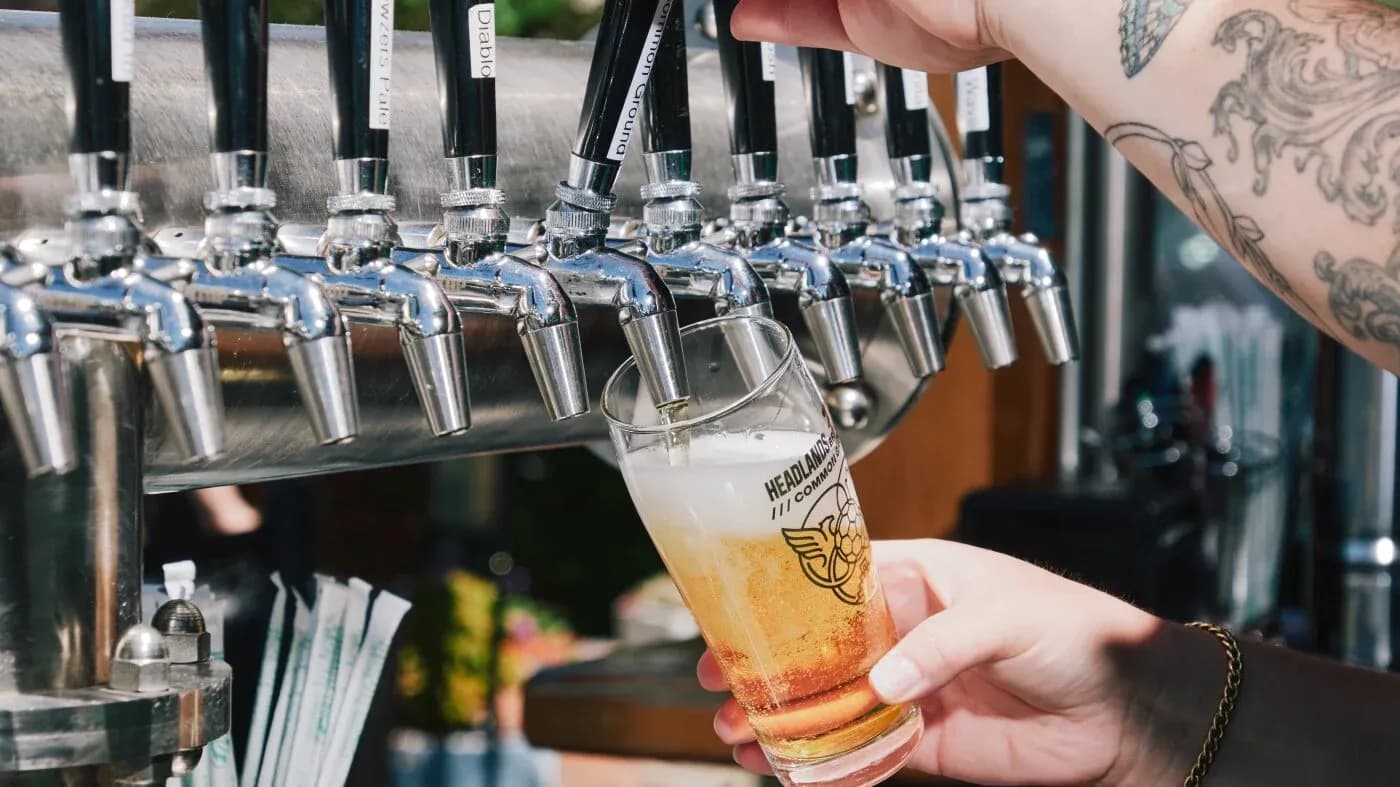 Pint being poured from a beer tap Pint being poured from a beer tap