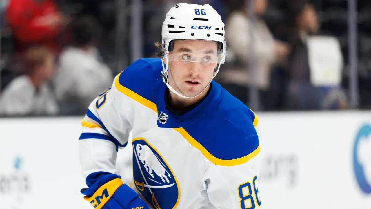 Hockey player wearing Buffalo Sabres jersey on ice Hockey player wearing Buffalo Sabres jersey on ice