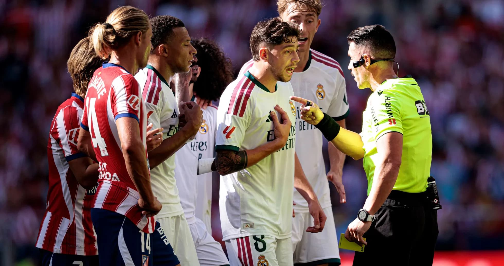 Real Madrid players arguing with the referee during match Real Madrid players arguing with the referee during match