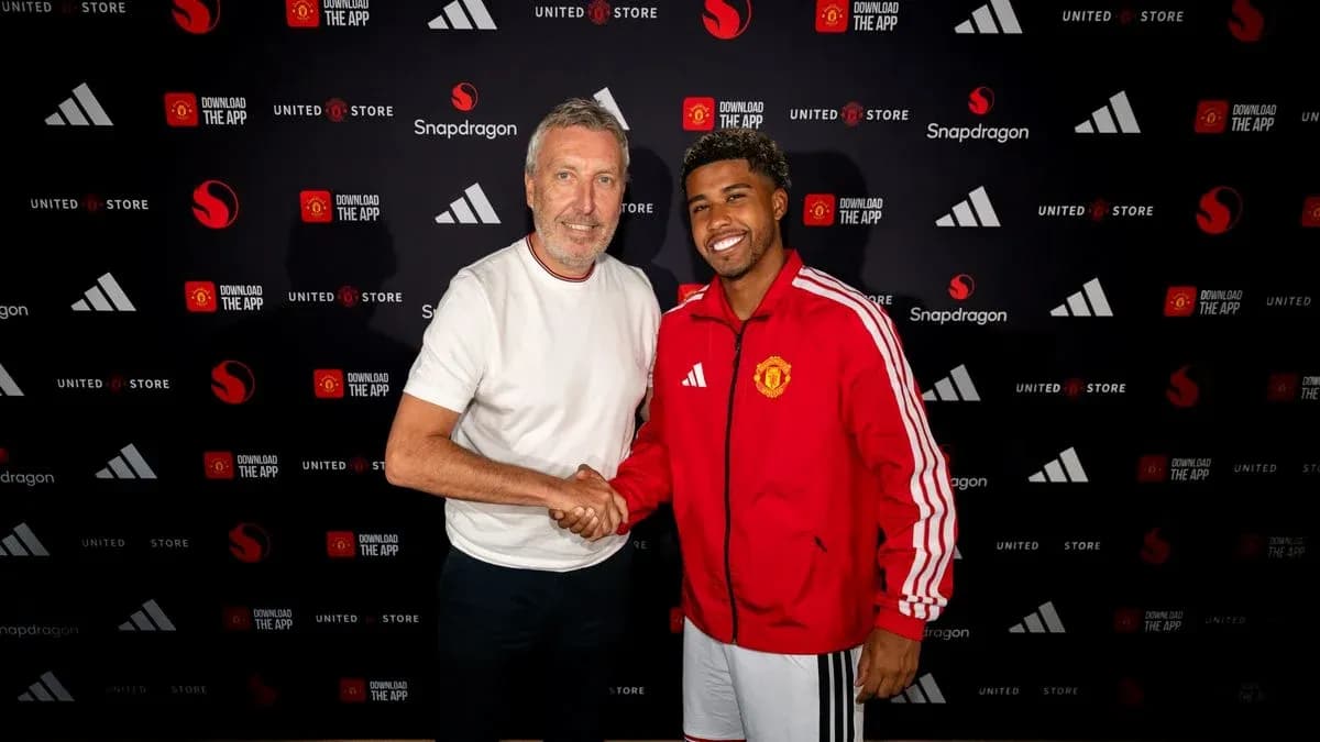 Two men shaking hands at Manchester United event Two men shaking hands at Manchester United event