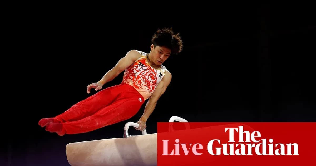 Gymnast performing on pommel horse during competition Gymnast performing on pommel horse during competition