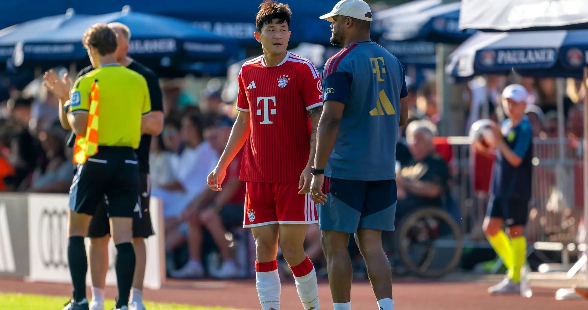 Bayern Munich player talking to coach during match Bayern Munich player talking to coach during match