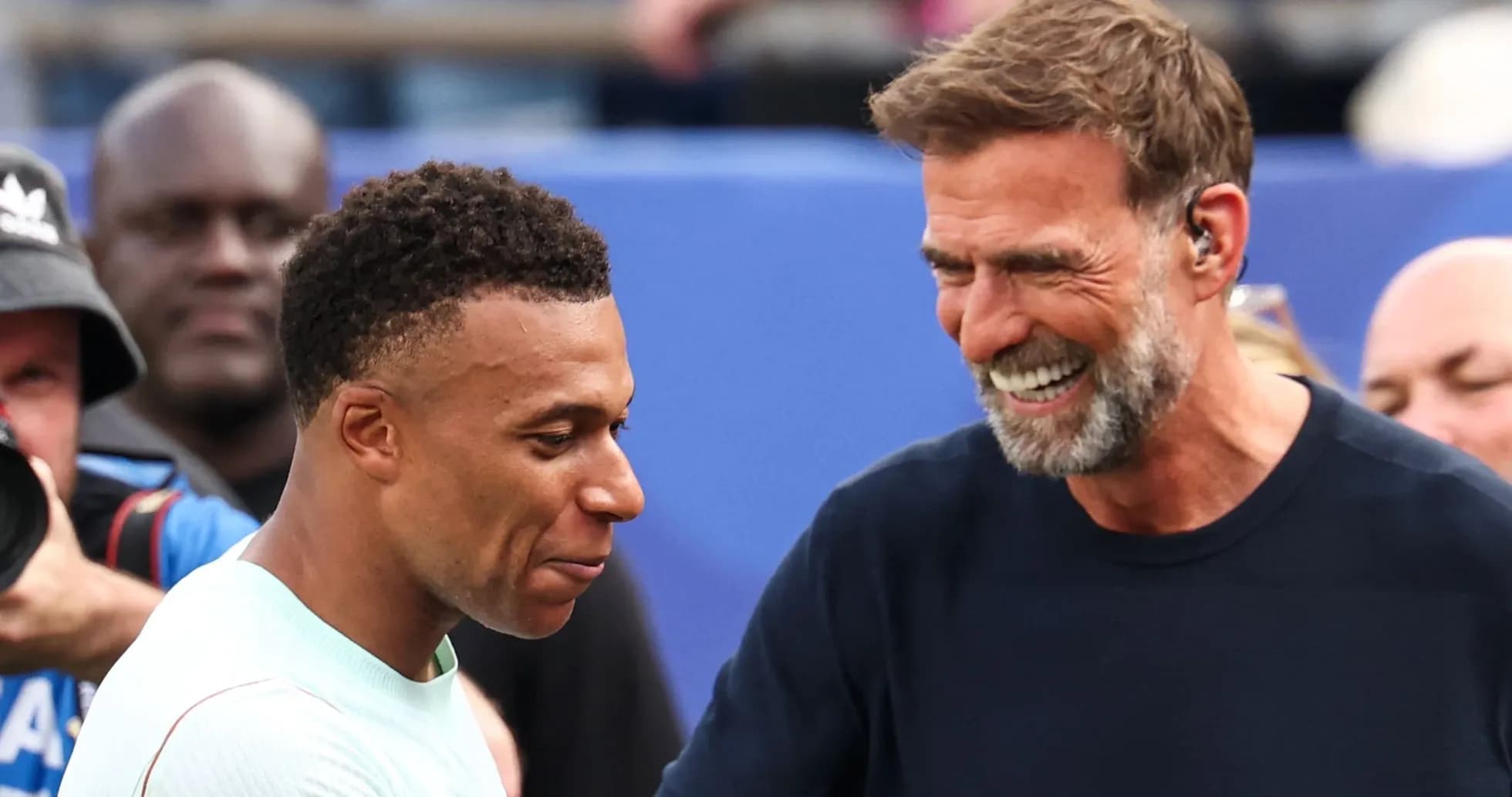 Mbappé and Klopp smiling during an event Mbappé and Klopp smiling during an event