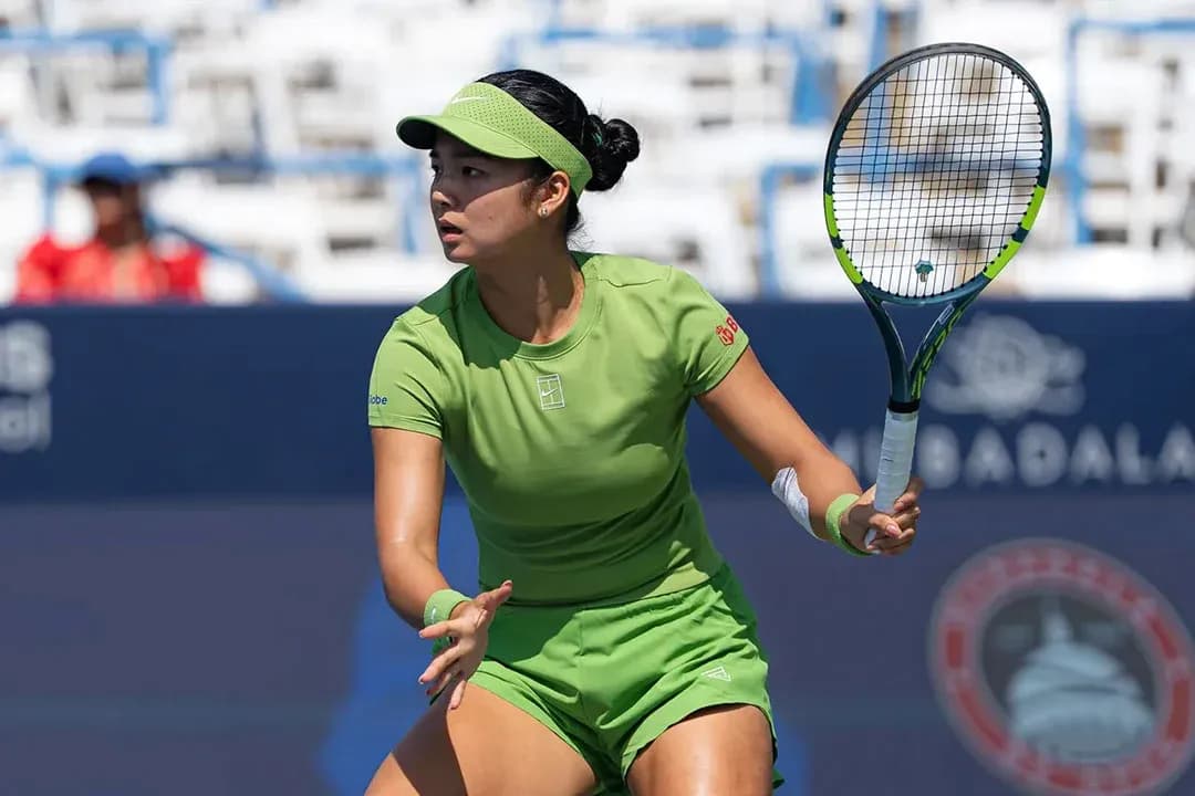 Tennis player preparing to hit a shot on court Tennis player preparing to hit a shot on court