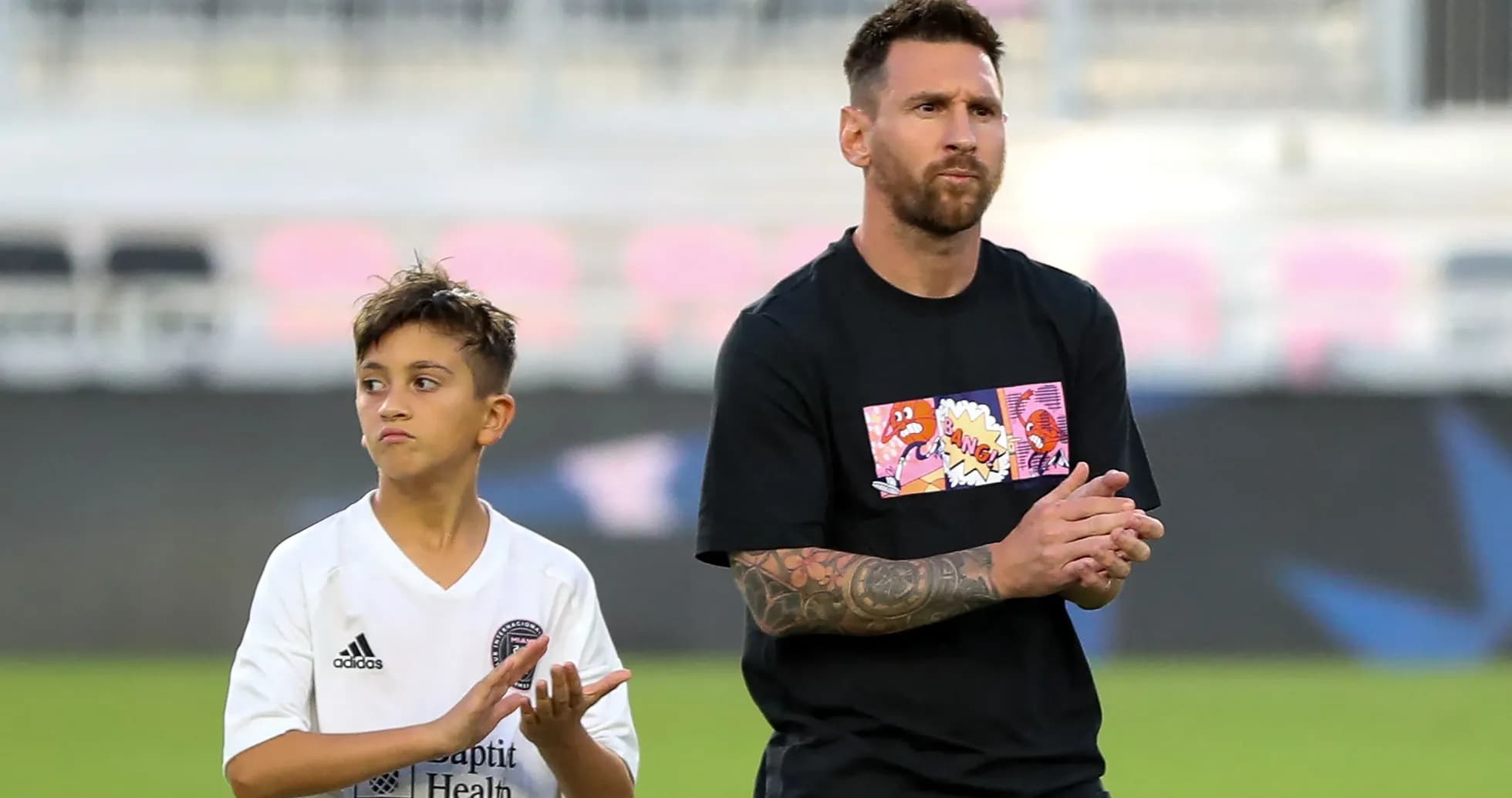 Messi and child clapping during a warm-up Messi and child clapping during a warm-up
