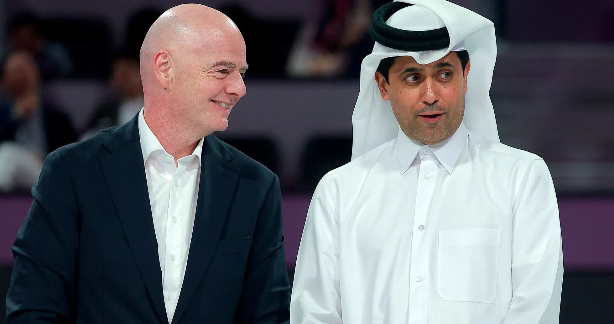 Two officials speaking at an event in Qatar Two officials speaking at an event in Qatar