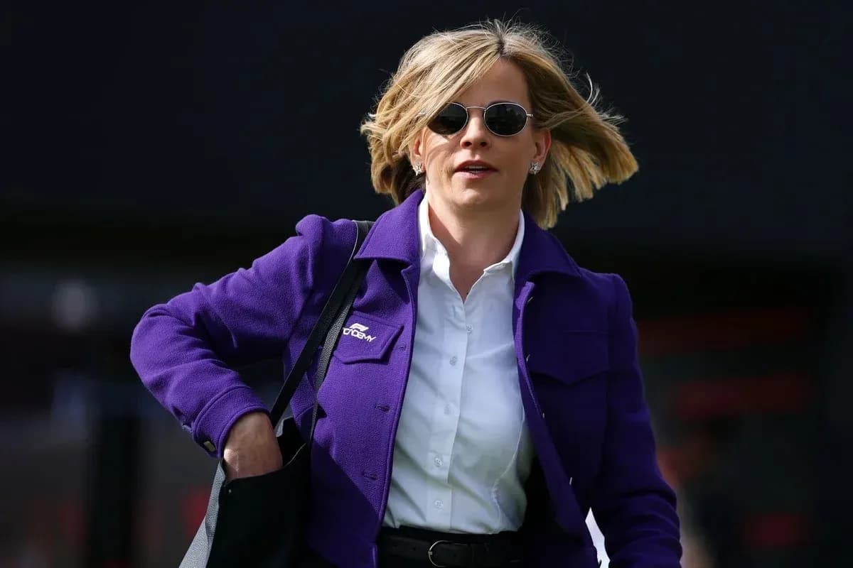 Woman in purple jacket walking with handbag Woman in purple jacket walking with handbag