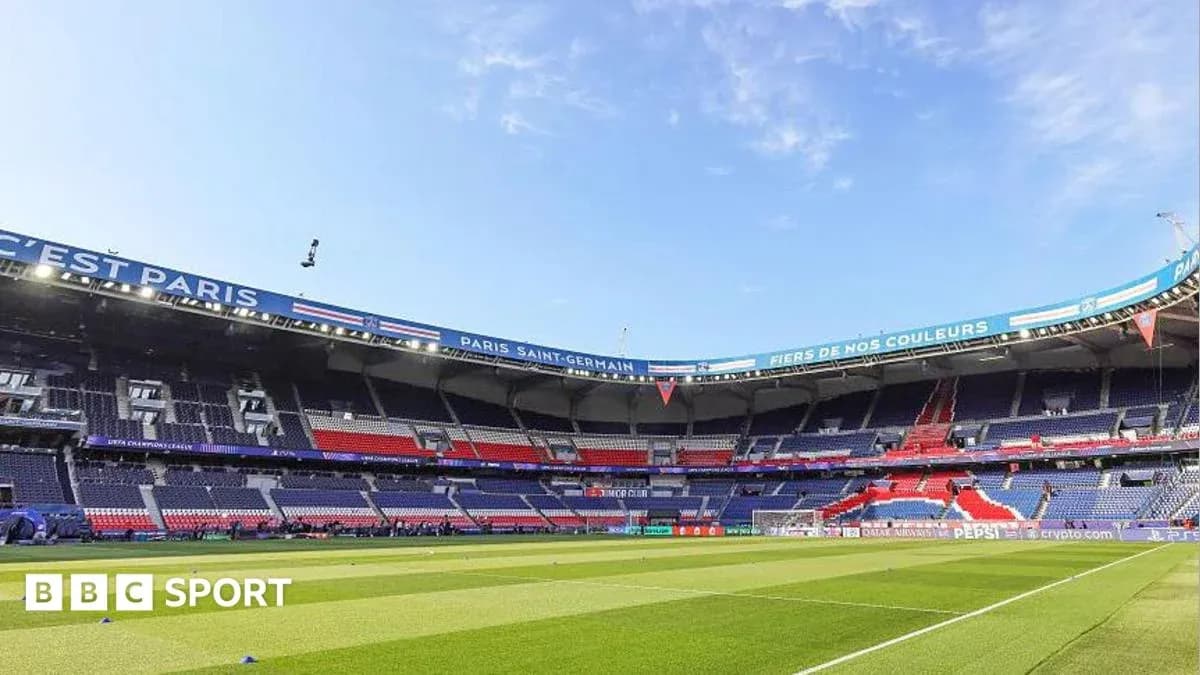 Paris Saint-Germain stadium with empty seats and pitch Paris Saint-Germain stadium with empty seats and pitch