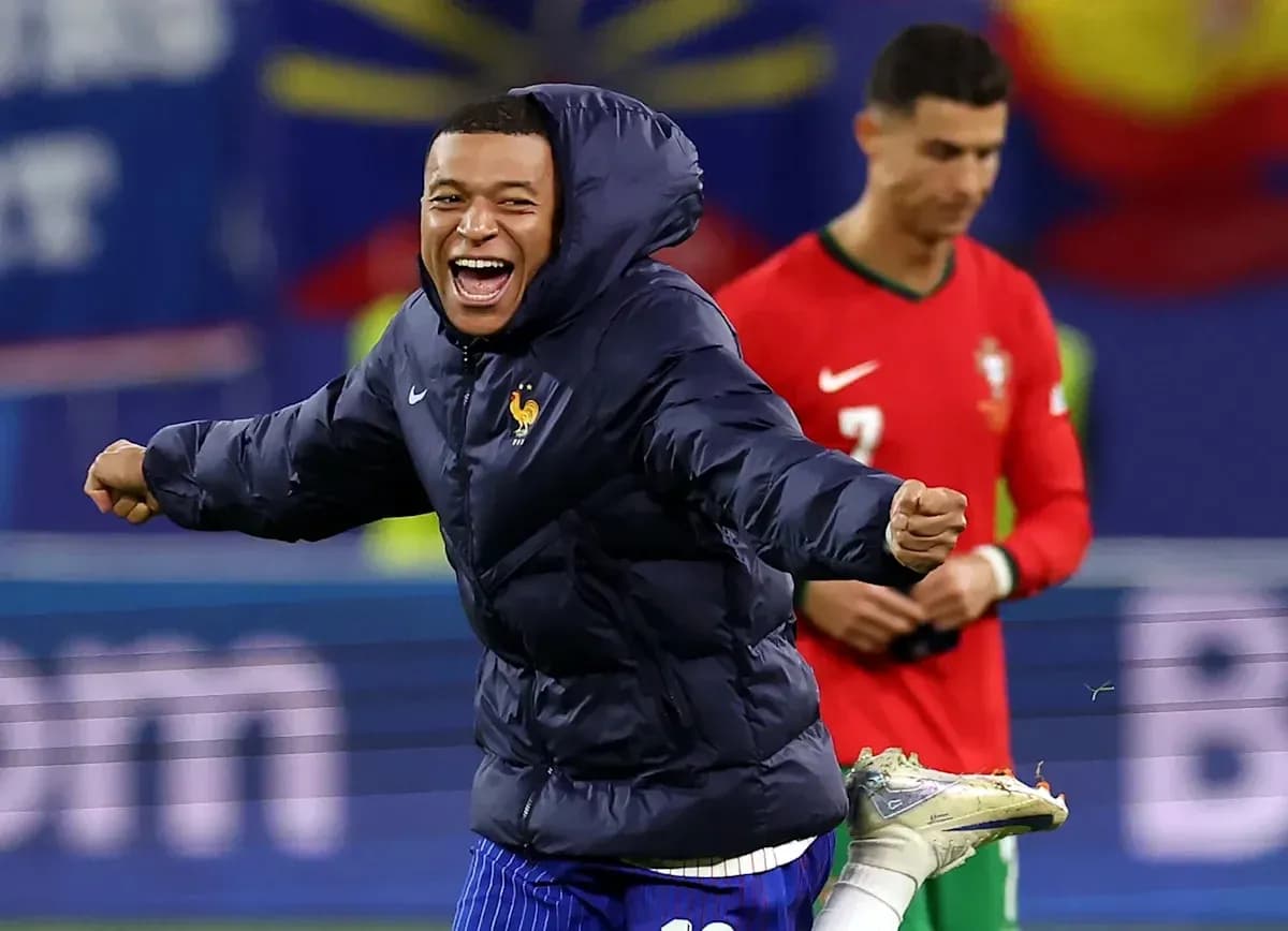 Mbappe celebrating on field with Ronaldo in background Mbappe celebrating on field with Ronaldo in background