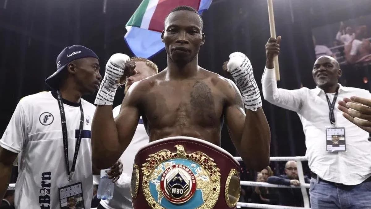 Boxer celebrating with championship belt after victory Boxer celebrating with championship belt after victory