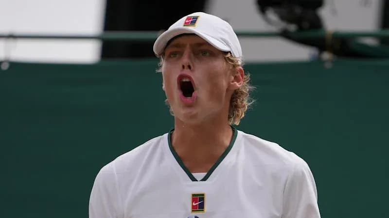 Tennis player celebrating during match at Wimbledon Tennis player celebrating during match at Wimbledon