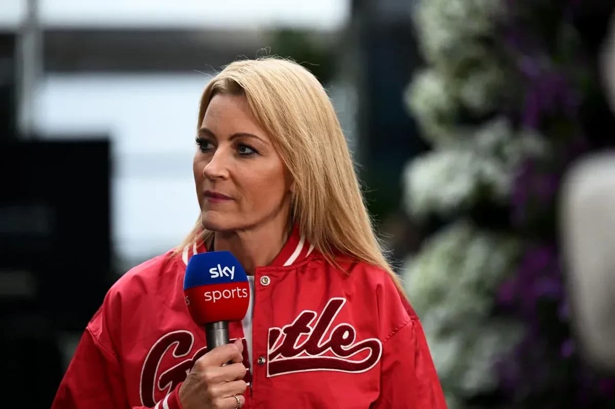 Television presenter speaking into microphone at event Television presenter speaking into microphone at event