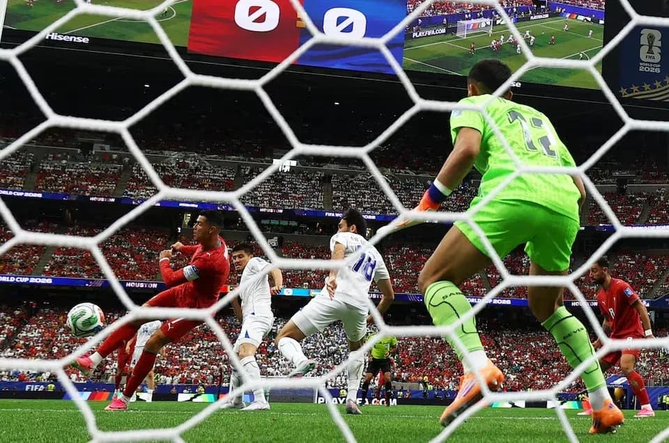 Goalkeeper preparing to block shot during match Goalkeeper preparing to block shot during match