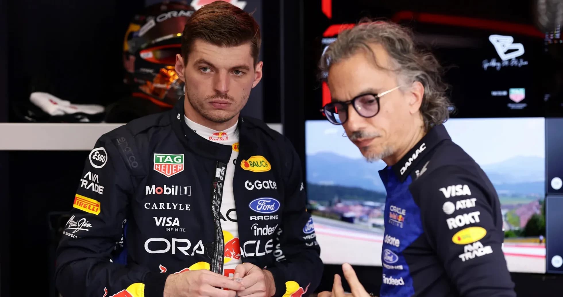 F1 driver and engineer discussing in garage F1 driver and engineer discussing in garage