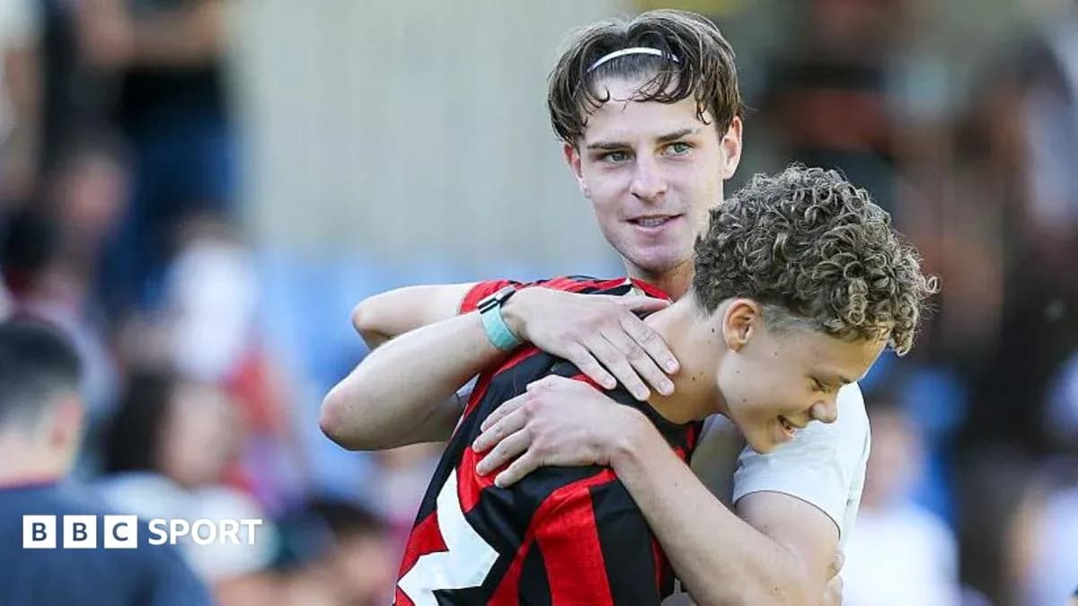 Two players embracing after a match Two players embracing after a match