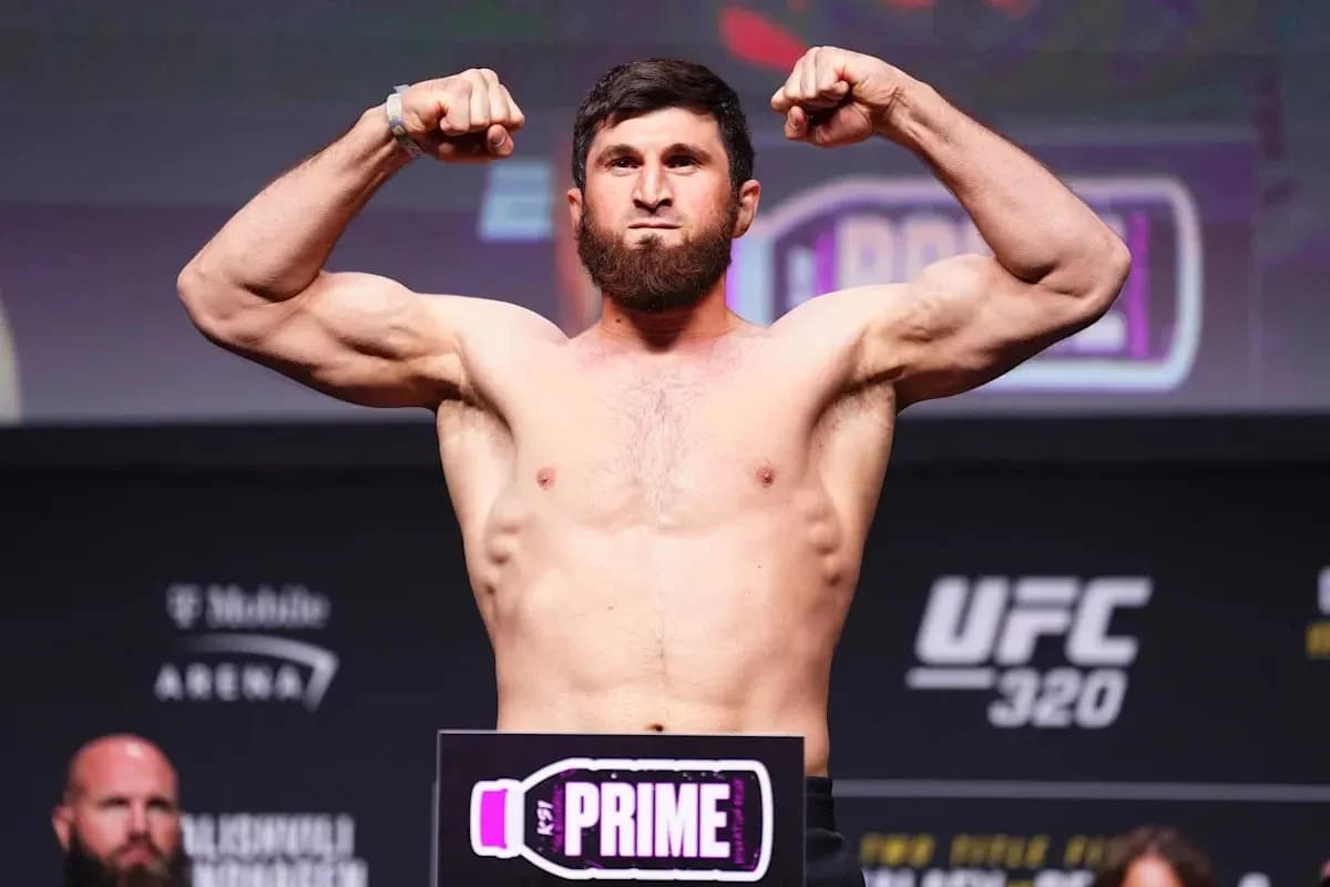 Fighter flexing muscles during weigh-in event Fighter flexing muscles during weigh-in event
